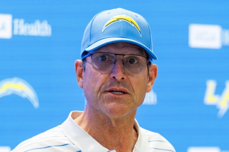 Former University of Michigan coach Jim Harbaugh named in class action suit against Matt Weiss
